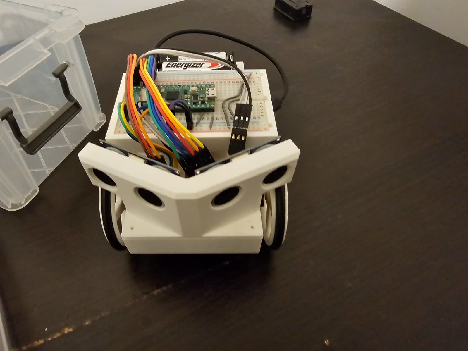 Maze robot front view showing angled sensor pods and drive wheels